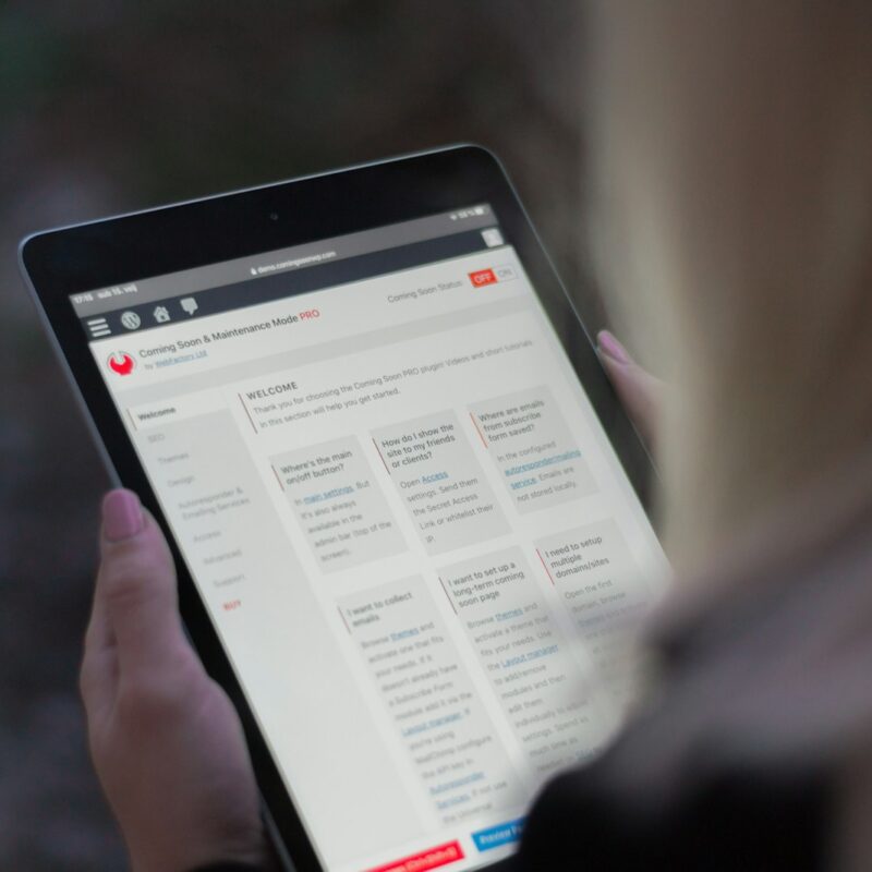 person holding black tablet computer